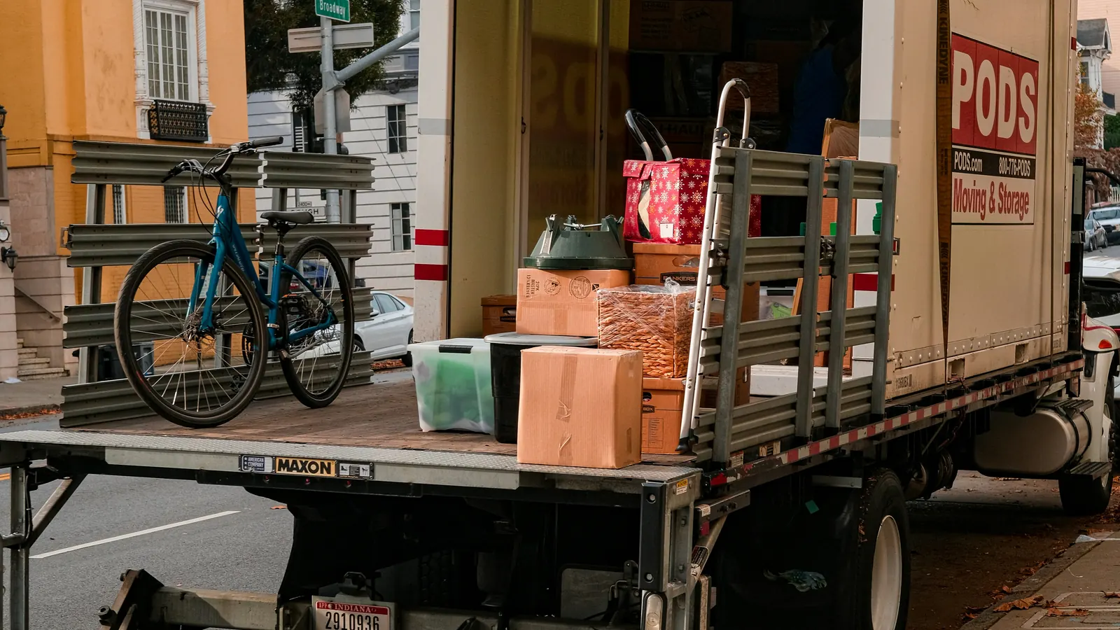 Moving truck loaded with boxes showing how volume-based hauling is estimated